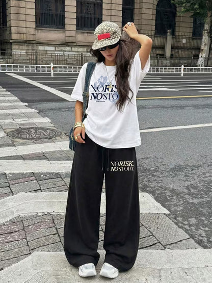 "NO RISK, NO STORY" Oversized Streetwear Set – White Drop-Shoulder Graphic Tee & Black Wide-Leg Trousers